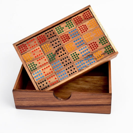 Woodtastic double-15 domino set with 136 wooden tiles featuring colourful dots in red, blue, green, and orange, stored in a wooden box.