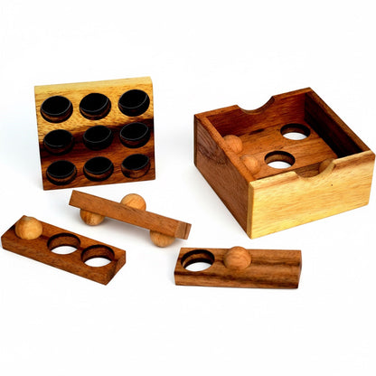 Woodtastic Easy Box 3D wooden puzzle with 6 pieces, made from Samanea wood. Features a box and several wooden pieces with holes and balls.