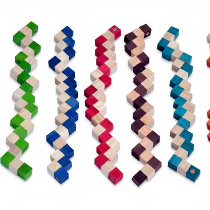 Woodtastic Snake Cube Level Box M, a set of 6 wooden puzzles in green, blue, red, purple, and teal, each with alternating colored and natural wood cubes.