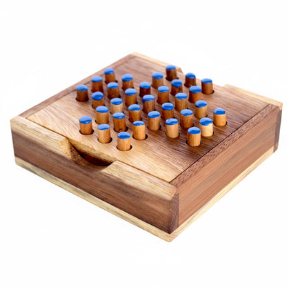 Woodtastic small solitaire game box made of Samanea wood with blue-topped pegs. A classic single-player strategy game.