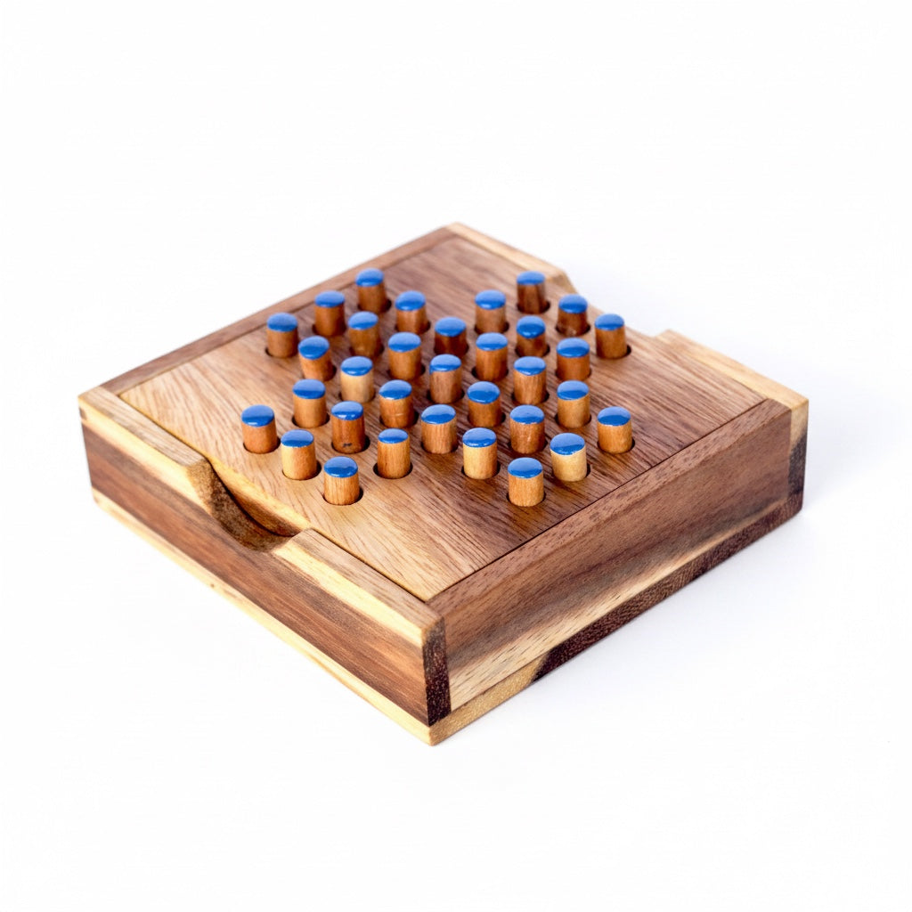 Woodtastic small solitaire game box made of Samanea wood with 33 blue-topped pegs. Classic thinking game for one player.
