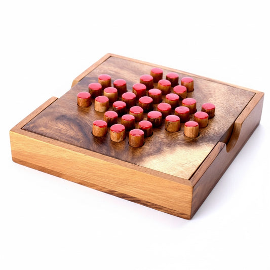 Woodtastic large solitaire game board made of Samanea wood with 33 red-topped wooden pegs.